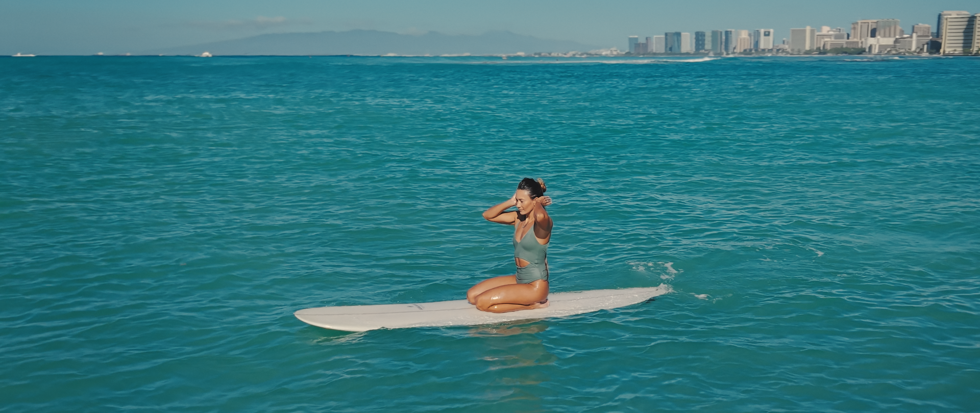women surfing waves in hawaii 